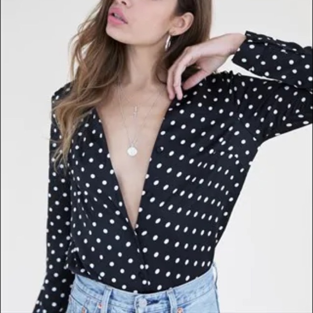 Polka-dotted sustainable blouse.